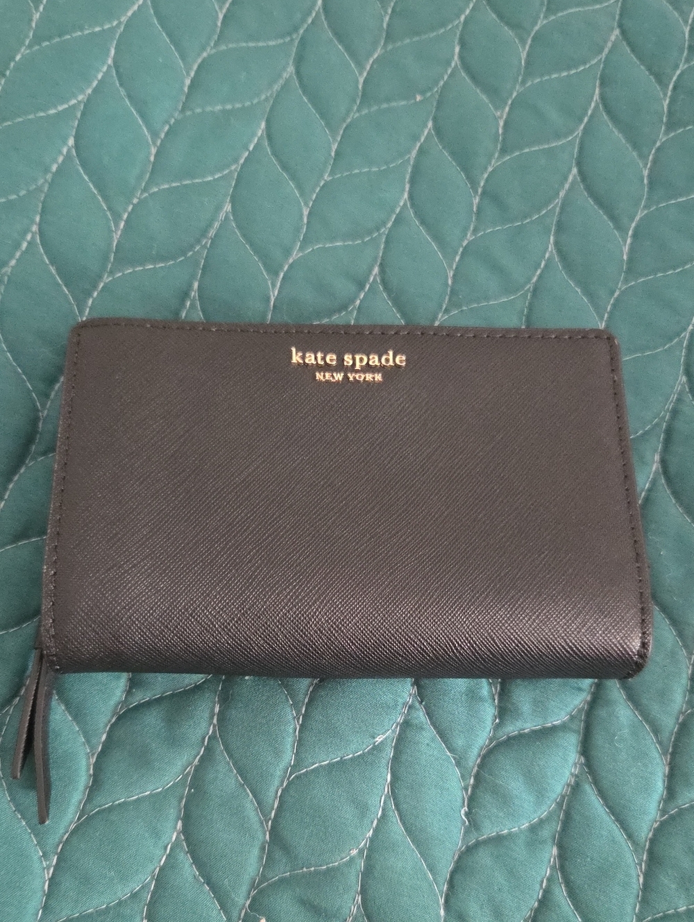 kate spade black saffiano leather zip wallet with gold logo